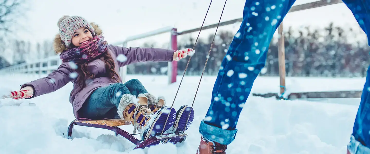 Family winter vacation - tobogganing activity